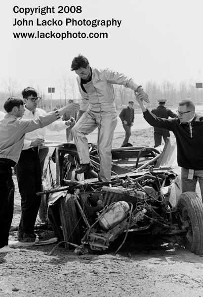 US-131 Motorsports Park - BRANNAN IS HELPED OUT OF HIS WRECK AFX MUSTANG AFTER FLIPPING IT MAY 1966 FROM JOHN A LACKO WWW LACKOPHOTO COM